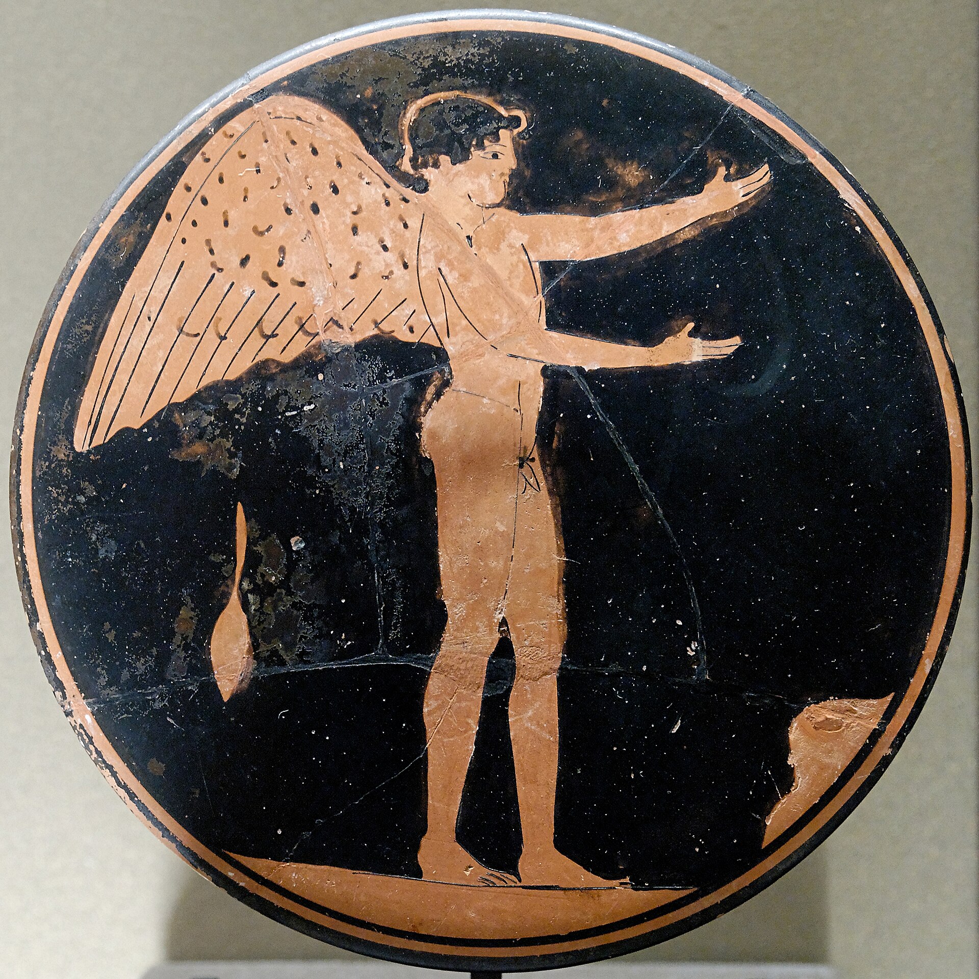 Attic red-figure bobbin showing a winged youth Eros, Louvre CA 1798.