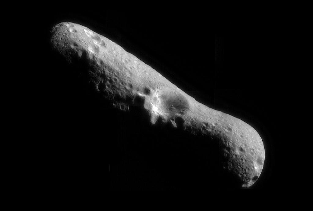 First whole-Eros mosaic from orbit, looking over the north pole into a large crater.